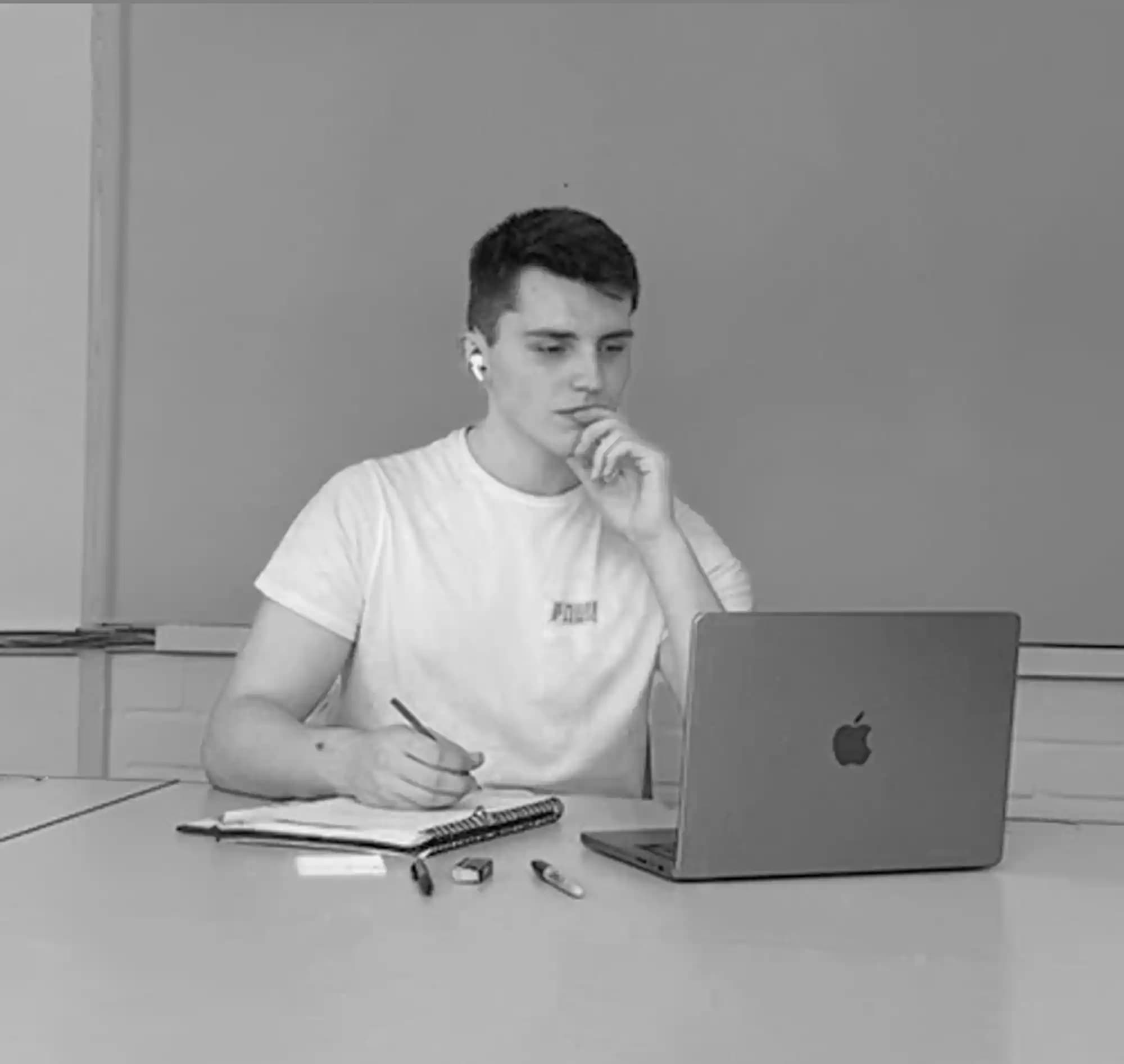Portrait of Matt Perks working at his desk